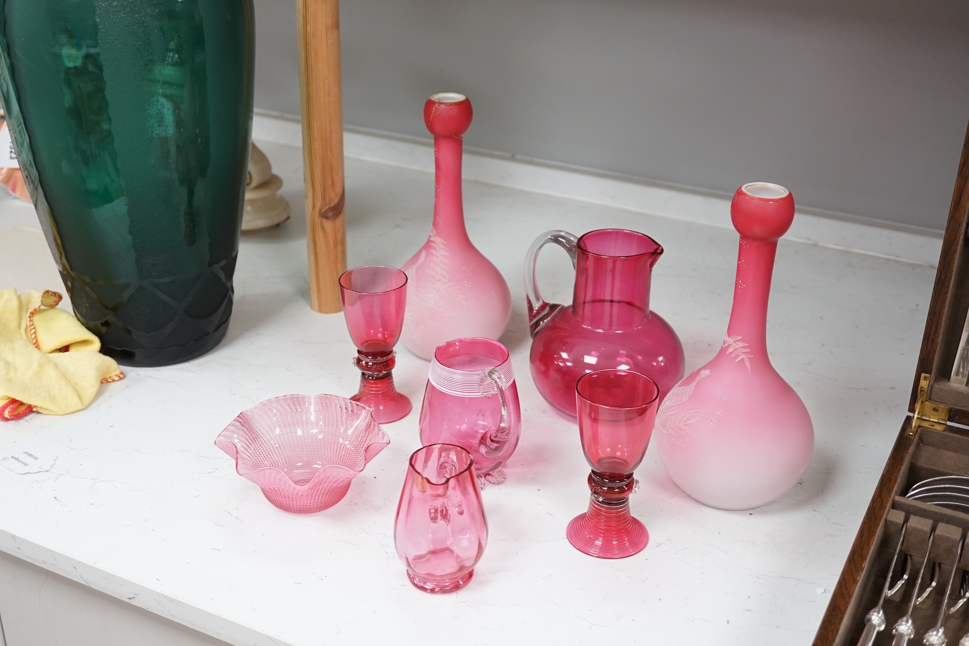 A pair of Victorian pink satin long necked vases, 25cm high, and five pieces of cranberry coloured glassware, (8). Condition - fair to good.